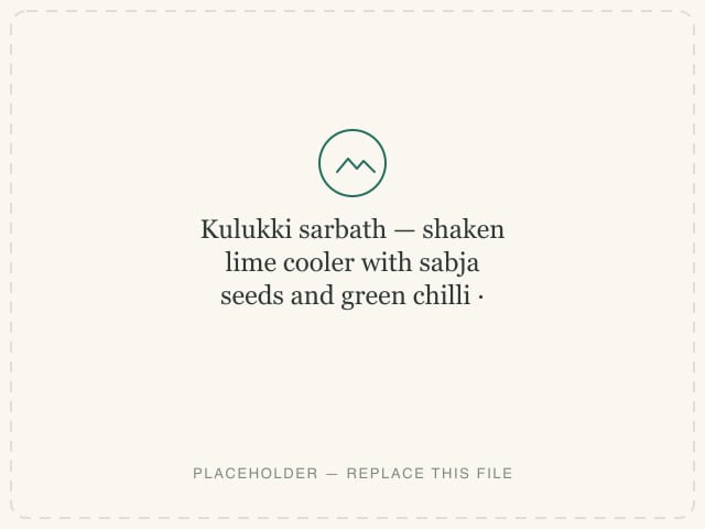 Kulukki sarbath — shaken lime cooler with sabja seeds and green chilli — photograph