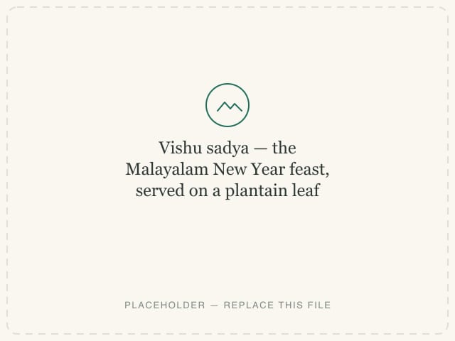 Vishu sadya — the Malayalam New Year feast, served on a plantain leaf — photograph